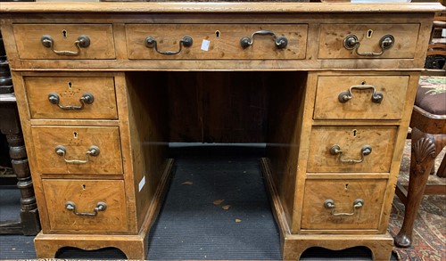 Lot 555 - A birds eye walnut small pedestal desk with...