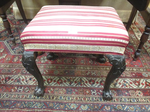 Lot 576 - A George III style upholstered stool on...