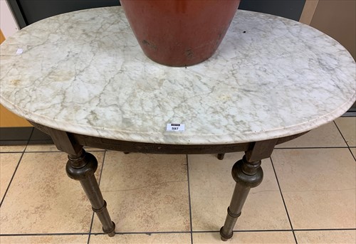 Lot 597 - A marble topped oval occasional table on a...