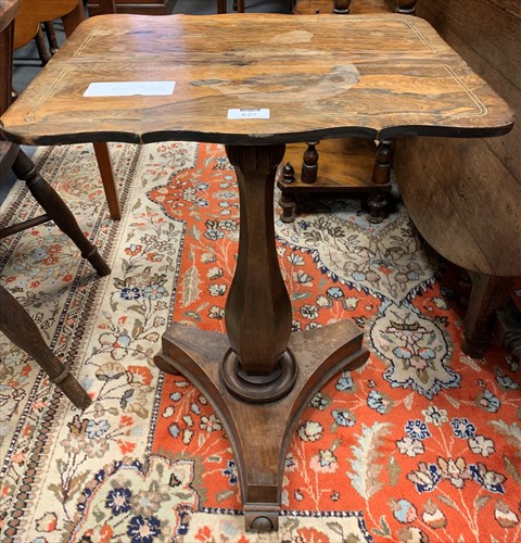 Lot 627 - A Victorian rosewood wine table on triform...
