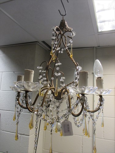 Lot 658 - A small glass chandelier with amber drops