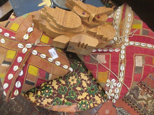 Lot 296 - A pottery charger, two African cushions and...