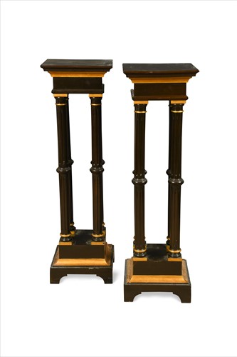Lot 366 - A pair of brown lacquer and gold painted torcheres