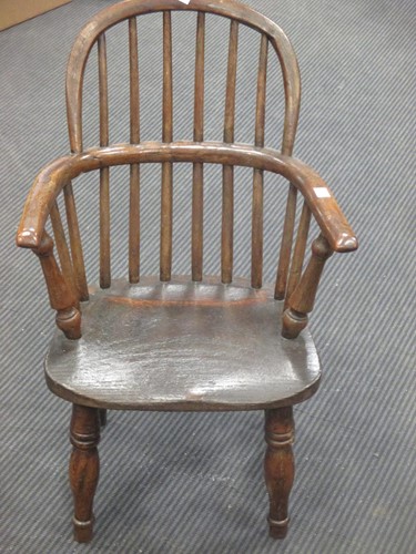 Lot 469 - A 19th century child’s Windsor armchair, on...