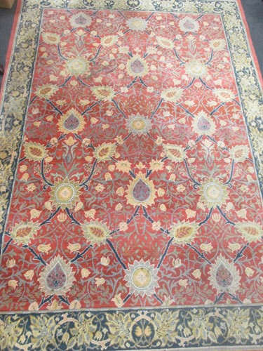 Lot 397 - A red ground Persian style rug with blue...