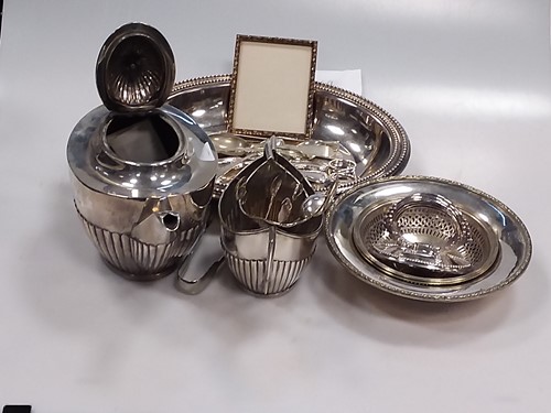 Lot 231 - A silver three piece tea set and a small...