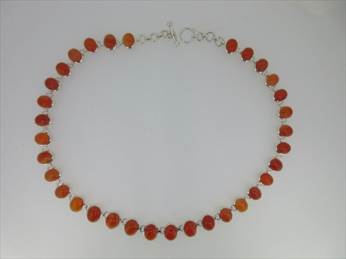 Lot 67 - A contemporary cornelian rivière necklace set in silver