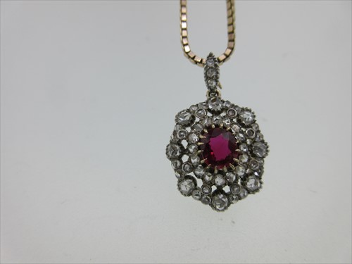 Lot 240 - An antique ruby and diamond pendant with later chain