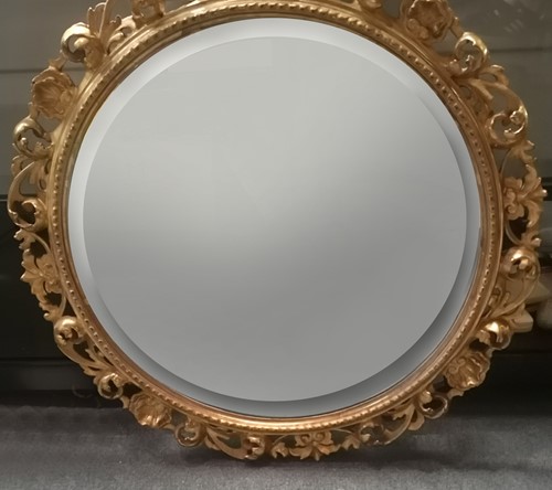 Lot 454 - A Florentine carved gilt wood circular wall...