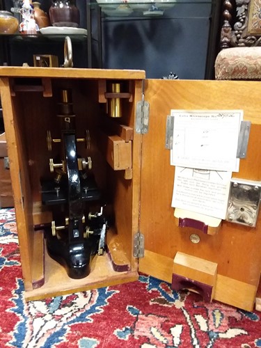 Lot 131 - A Leitz brass and black lacquer microscope,...