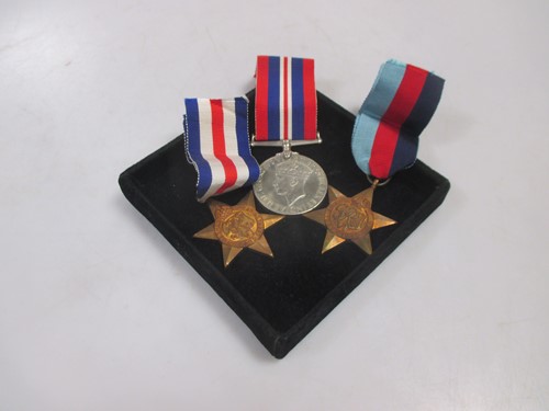 Lot 156 - A WW2 three medal set with box and paperwork...