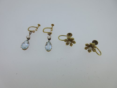 Lot 125 - A pair of aquamarine and pearl earpendants together with a pair of diamond set flower earrings