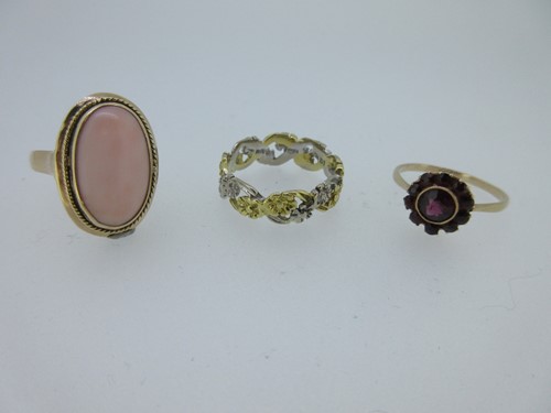 Lot 204 - An 18ct bi-coloured band ring and two gemset rings