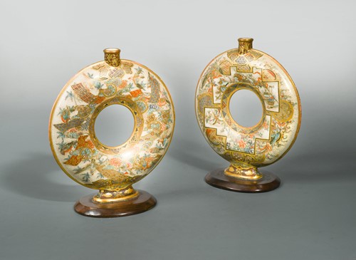 Lot 166 - A pair of Japanese earthenware annular vases, late Meiji (1868-1912)