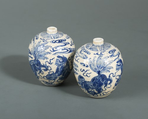 Lot 72 - A pair of Chinese soft paste blue and white porcelain small vases, late Qing Dynasty/early 20th century