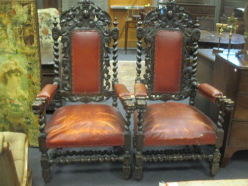 Lot 515 - A pair of carved oak armchairs with barley...