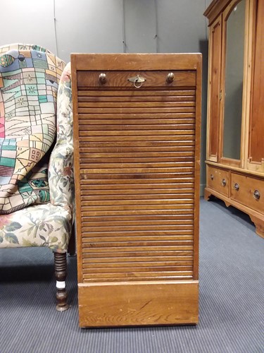 Lot 484 - Oak tambour filing cabinet by Maples 100 x 45...