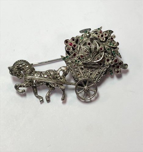 Lot 301 - Bucherer - A lapel brooch with hidden timepiece