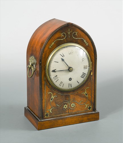 Lot 259 - A Regency mahogany and brass inlaid arched case mantel timepiece