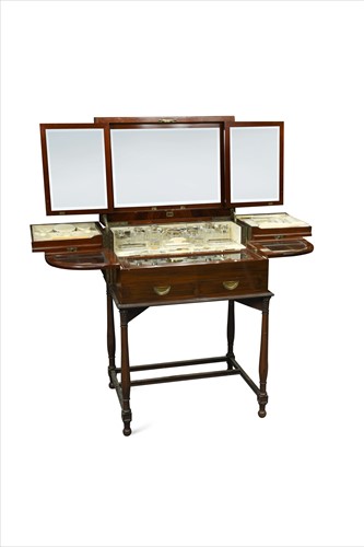 Lot 411 - An Edwardian flame mahogany fitted dressing table