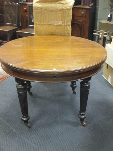 Lot 505 - A late 19th century extending dining table...