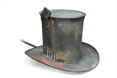 Lot 377 - A toleware and wrought iron mounted hatter's shop sign, probably French