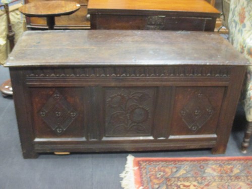 Lot 490 - An oak chest, late 17th c, but later centre...