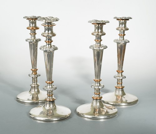Lot 376 - A set of four 19th century Old Sheffield Plate candlesticks