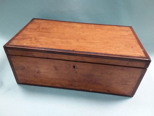 Lot 214 - A George III satinwood writing slope