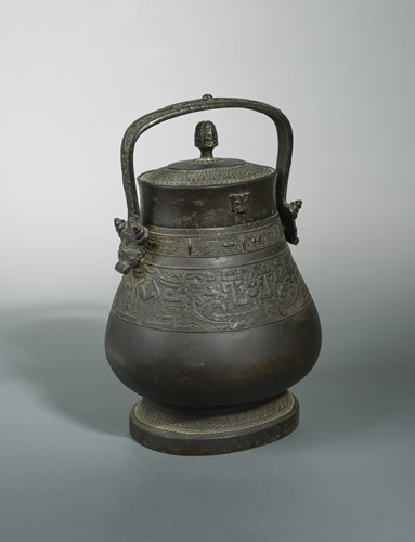 Lot 149 - A Chinese bronze 'YUE' in archaic style, perhaps Qing Dynasty