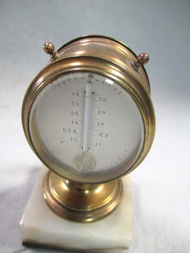 Lot 51 - A French desk top thermometer and barometer