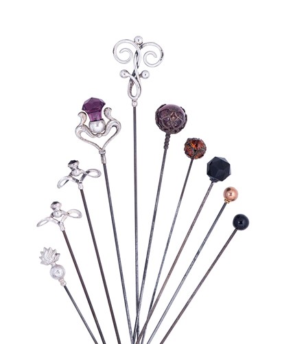 Lot 329 - A collection of Edward VII silver topped hat-pins by Charles Horner