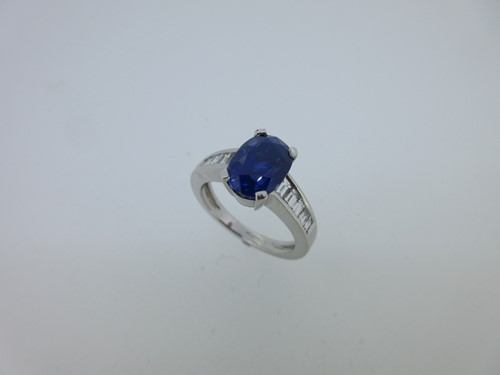 Lot 230 - A modern sapphire and diamond ring