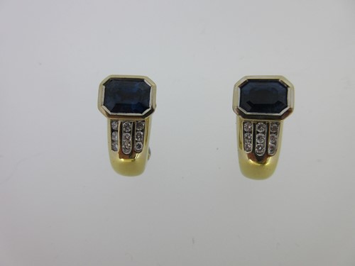 Lot 127 - A pair of modern sapphire and diamond post and clip earrings