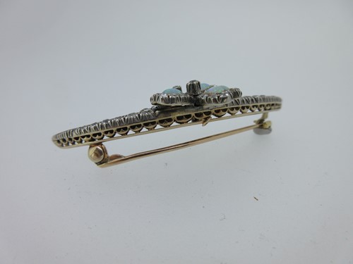 Lot 256 - An antique diamond crescent and opal shamrock brooch