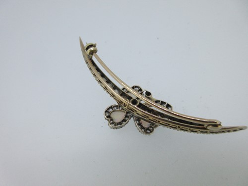 Lot 256 - An antique diamond crescent and opal shamrock brooch