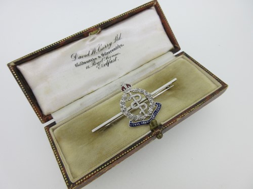 Lot 100 - A diamond and enamel Royal Army Medical Corps brooch