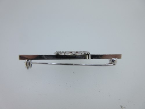Lot 100 - A diamond and enamel Royal Army Medical Corps brooch