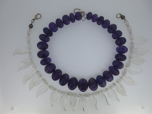 Lot 170 - A necklace of carved amethyst beads and another of carved rock crystal leaves
