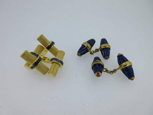 Lot 137 - A pair of sapphire set baton cufflinks together with a pair of lapis lazuli and ruby cufflinks