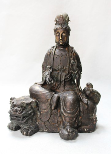 Lot 57 - A Chinese bronze model of Guanyin