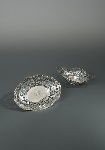 Lot 393 - Two Dutch metalwares silver pierced dishes, presented to British motor racing driver Joy Cooke
