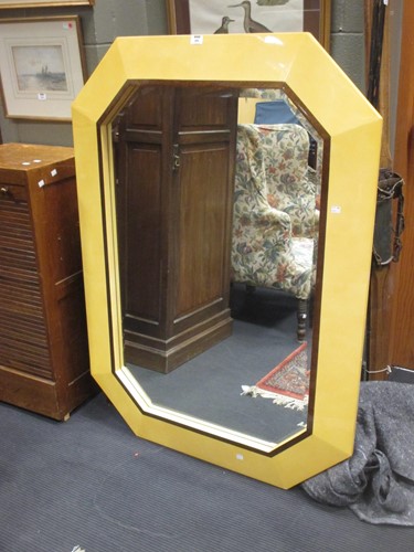 Lot 486 - A perspex canted frame wall mirror, bevelled...