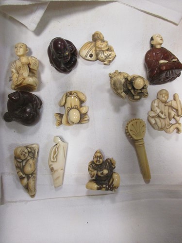 Lot 174 - Group of ivory and carved wood netsuke and...