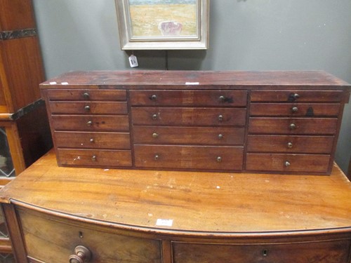 Lot 479 - A mid 19th century mahogany bank of 14 drawers...