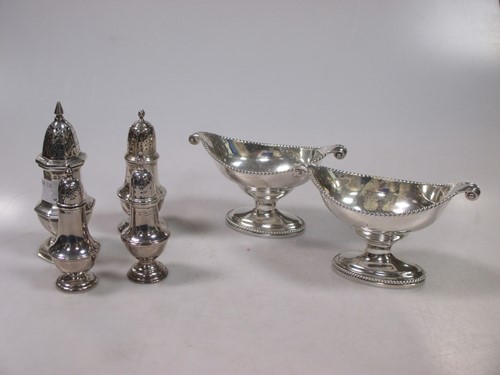 Lot 215 - A collection of four silver casters