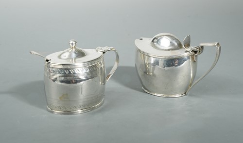 Lot 404 - A George III silver mustard by Henry Chawner, and another example