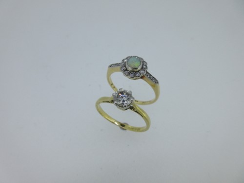 Lot 209 - A single stone diamond ring together with an opal and diamond cluster ring