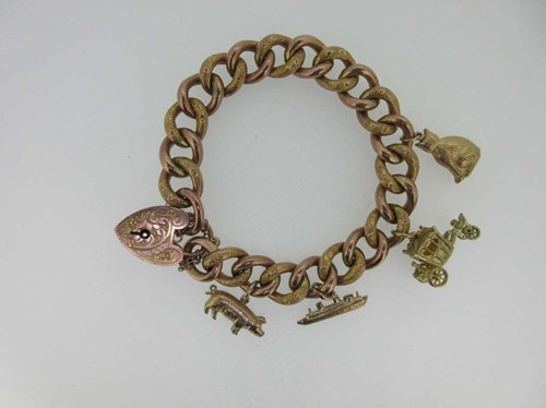 Lot 118 - A Victorian rose coloured bracelet with later charms
