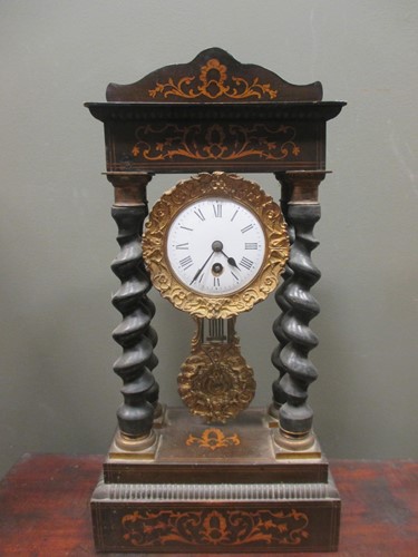 Lot 115 - A French Empire walnut mantle clock 48"